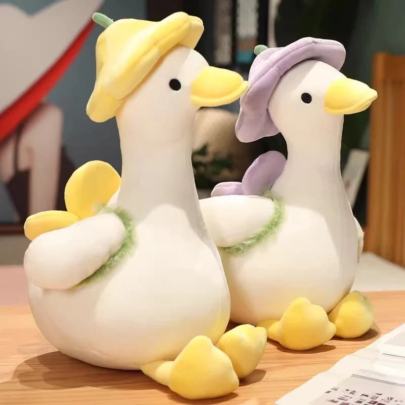 Peluche bambola di anatra gialla con zaino a fiori, simpatico cuscino di anatra, giocattoli di peluche di accompagnamento per decorazioni regalo per bambini