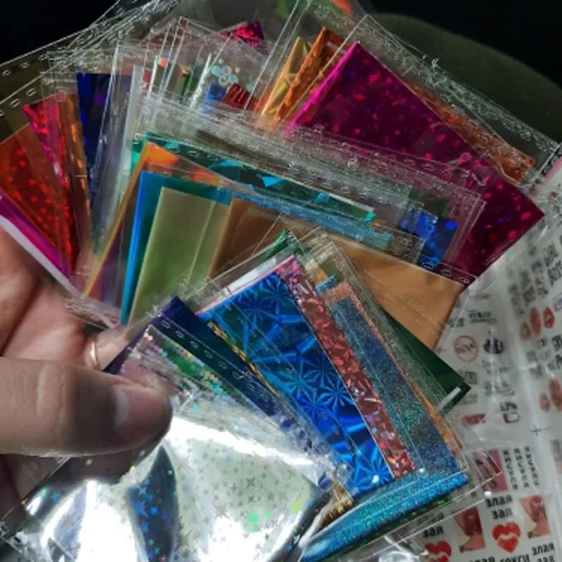 50 Pz/lotto Olografica Nail Foil Adesivo 4*20 cm Misto Trasferimento Cursore Nail Wraps Cielo Stellato UV GEL Laser Manicure Unghie artistiche Decalcomanie