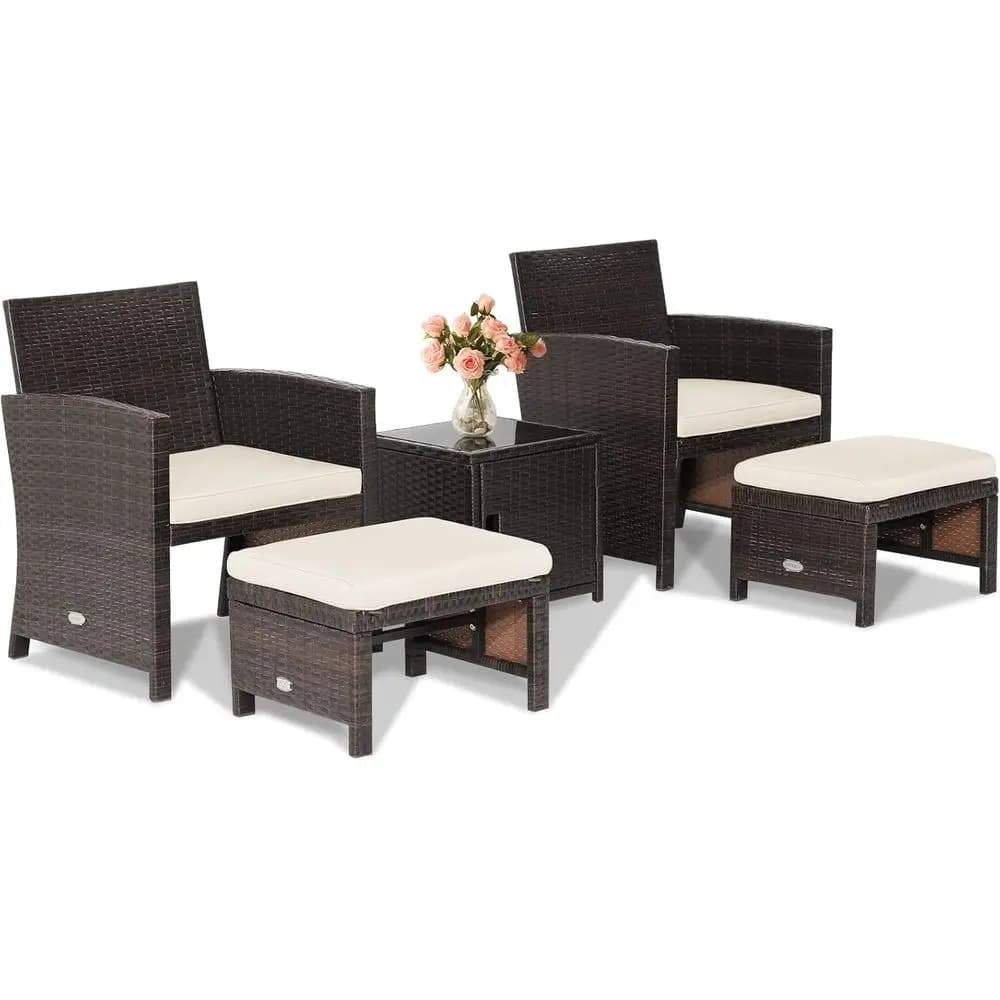Set of outdoor rattan furniture upholstered with 5 pieces with sofa, ottoman and table for patio, terrace or white garden