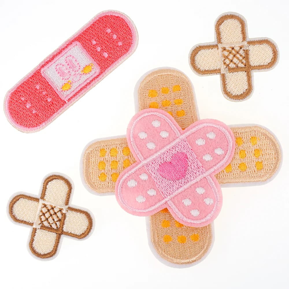 1 pezzo ​ Toppa ricamata con benda incrociata, applique in gesso per ferita, autoadesiva, adesiva, termoadesiva, per jeans, zaini per indumenti