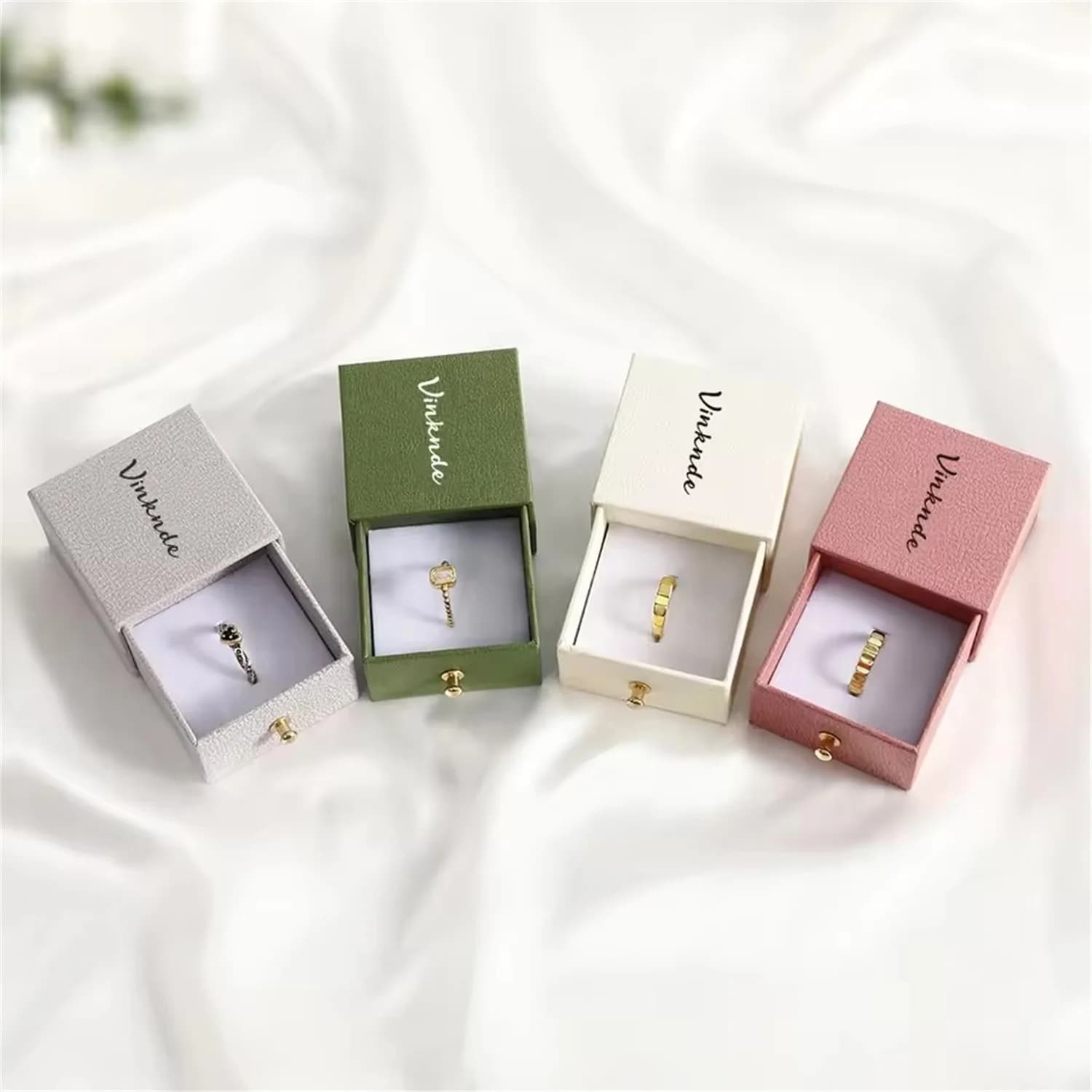 Boxes with cardboard paper drawers with custom logo with foam holders for necklaces and rings in jewelry packaging. Conservation of wedding gifts
