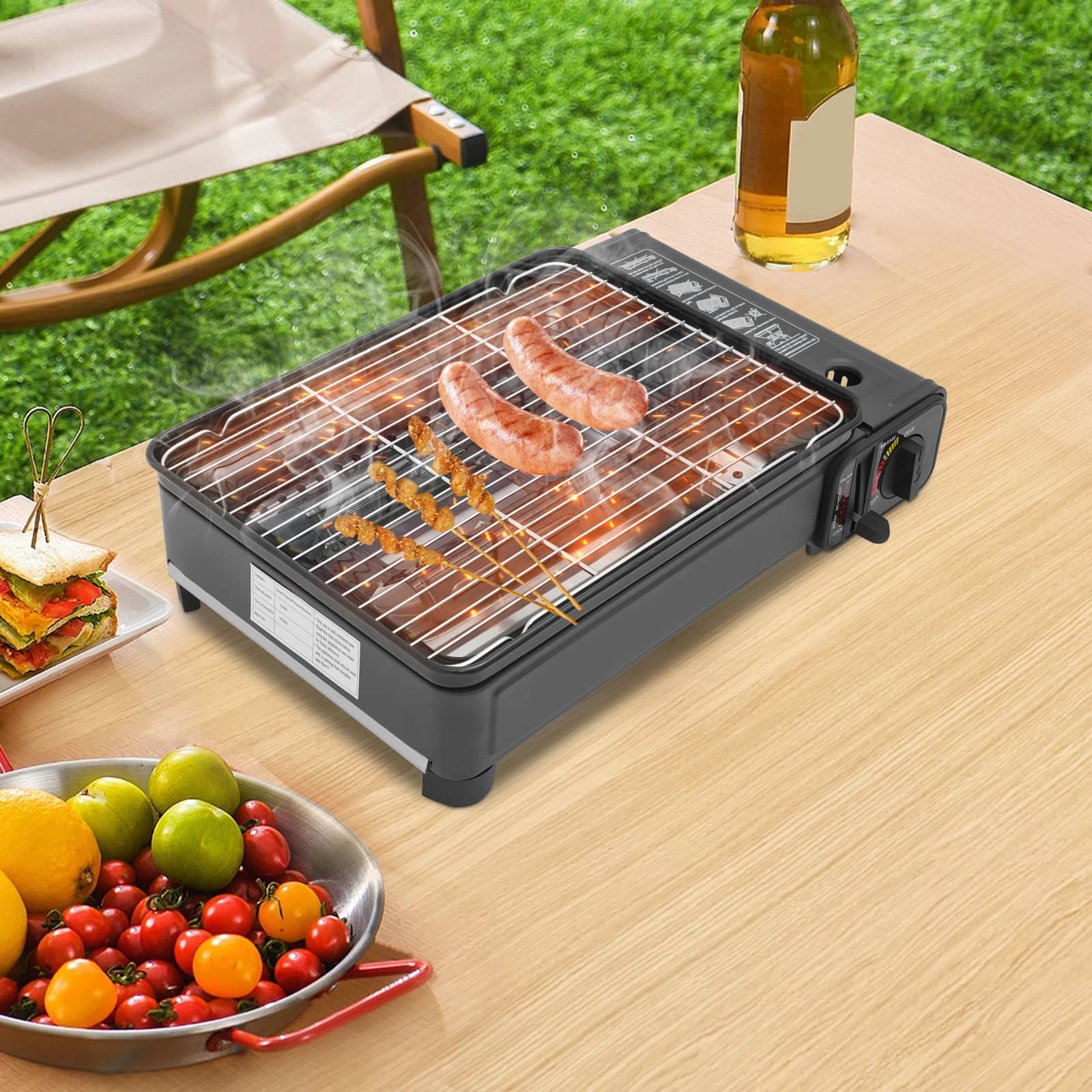 Black portable table gas cooker for camping with carrying case, compatible with butane and GPL, suitable for camping trips