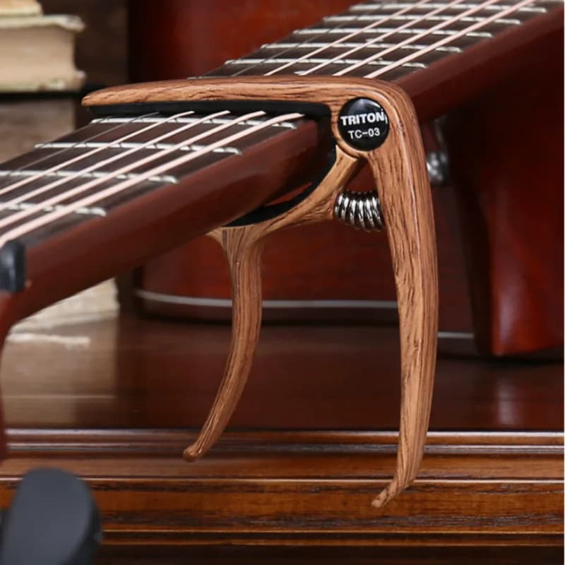 Portable Instrument Capo Clip Multifunctional Tone Changing Clamp Guitar Ukulele Playing SuppliesProduct Description