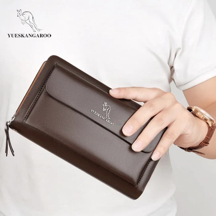 Men hold stylish, portable, simple, large-capacity mobile phones and multi-functional fashion travel business wallets