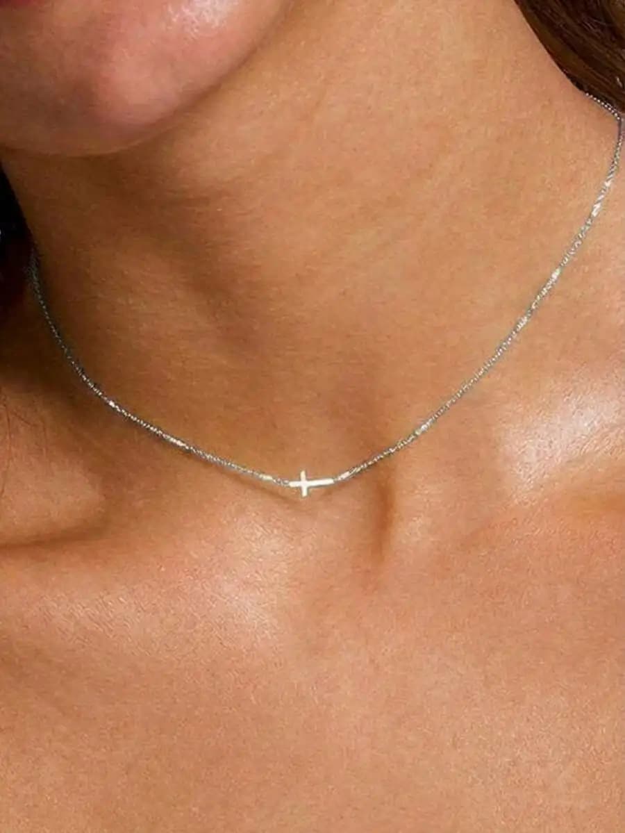 Adjustable silver necklace featuring delicate cross pendant—elegant, versatile, perfect for everyday wear