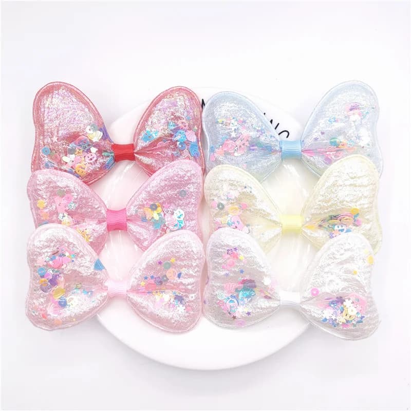 12 pz/lotto Glitter Bowknot Appliques di paillettes di riempimento in PVC trasparente per toppe per cappelli fai da te copricapo fermagli per capelli decorazione con fiocco