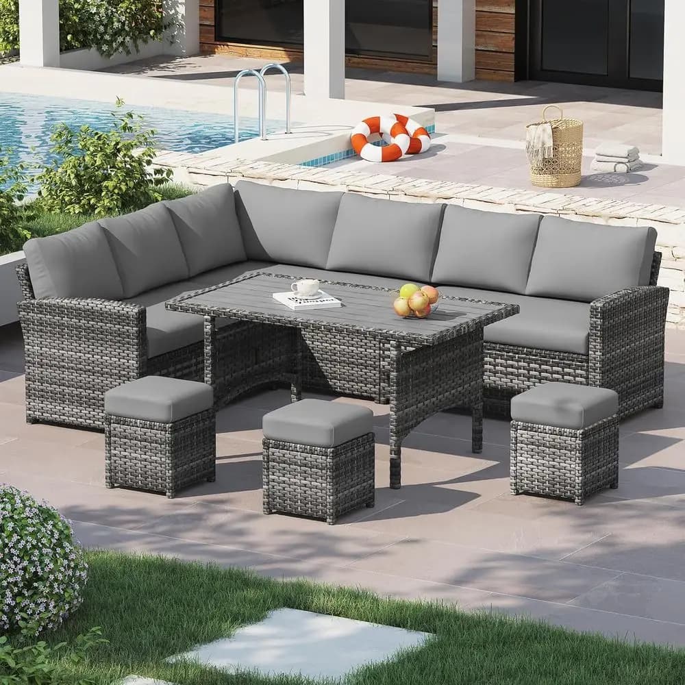 Set divano componibile da esterno a 7 pezzi con tavolo da pranzo, sedie e pouf in vimini resistente alle intemperie, colore grigio con cuscini grigi