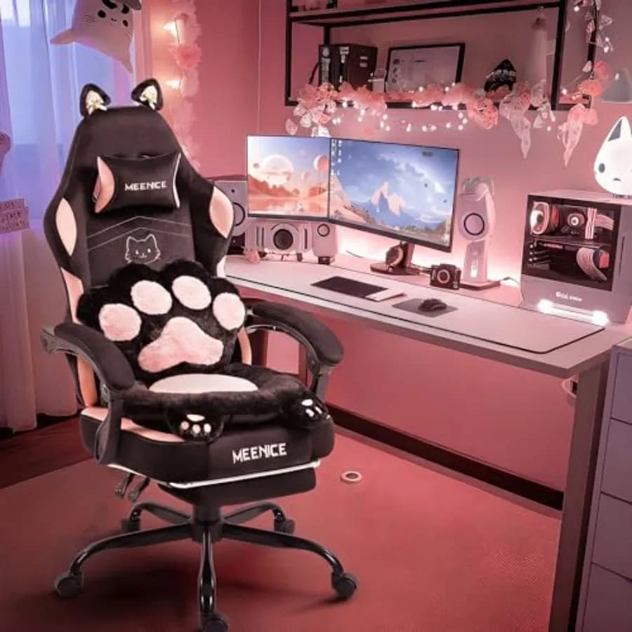 Pink gaming chair with cat ears and paw design, polyester fabric, ergonomic support with lumbar cushion and footrest, reclining