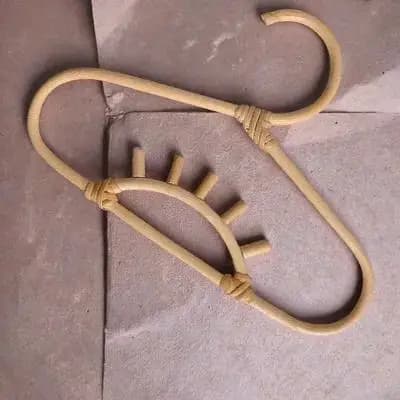 Rattan baby clothes hanger with smooth edges, safe for delicate fabrics, compact size, for infants and small children