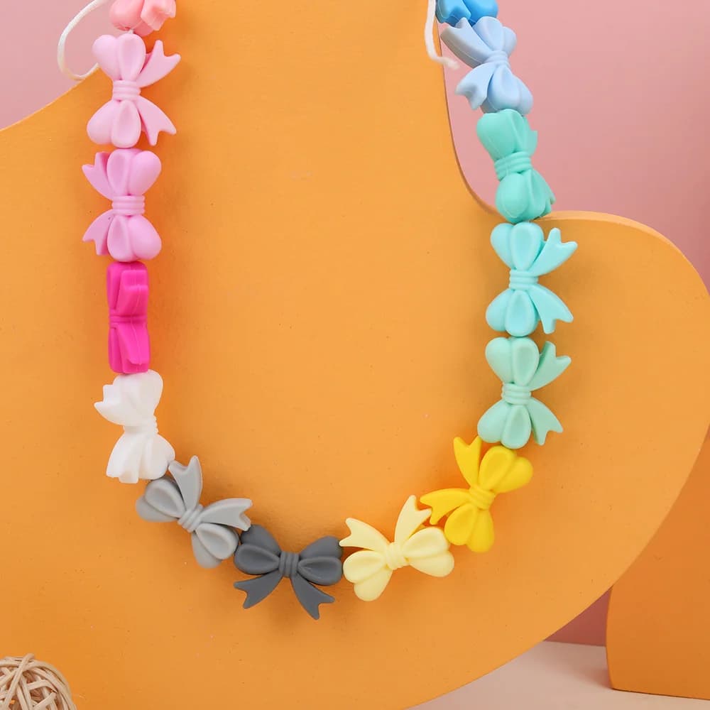 50-200 pezzi nuove perline in silicone multicolori a forma di fiocco per la creazione di gioielli fai da te, orecchini, bracciali, collane, ecc. Accessori personalizzati
