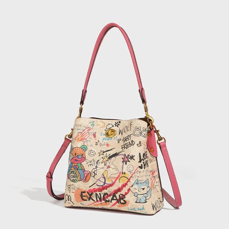 Borsa a secchiello graffiti color block di alta gamma 2026 Nuova borsa a tracolla piccola da donna con stampa di nicchia, versatile per l'uso quotidiano
