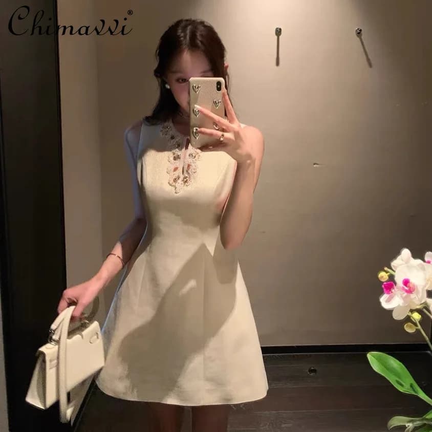 Abiti da festa da socialite dal temperamento francese elegante con diamanti girocollo senza maniche ampio a vita alta abito corto a trapezio da donna