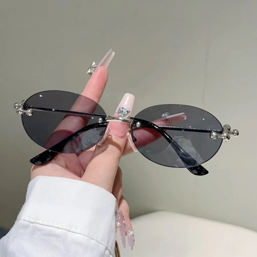 Oval frameless trimmed sunglasses 2026 new European and American ins net red sunglasses fashionable personality sunglasses wome