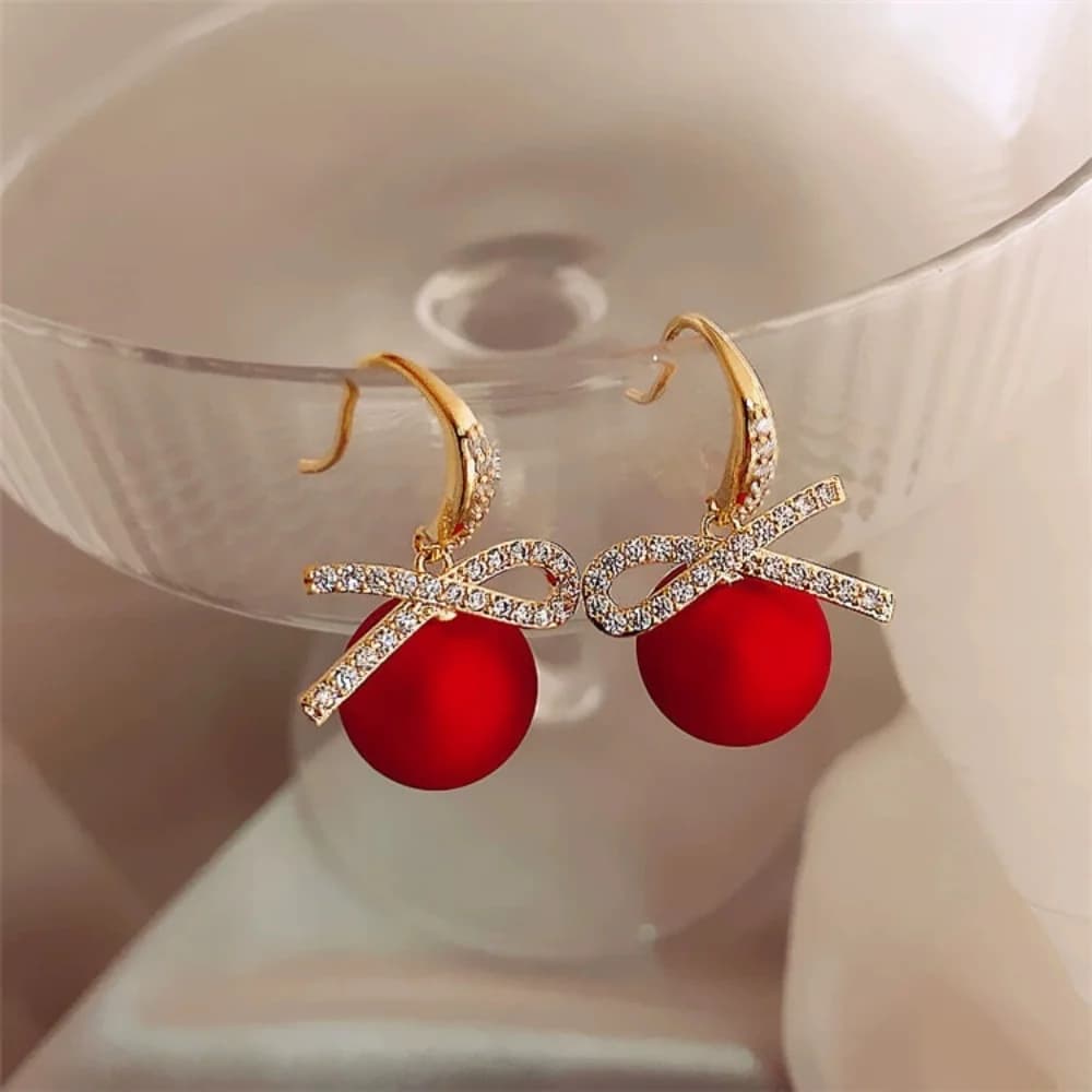 Orecchini pendenti alla moda con fiocco intarsiato di strass di lusso e perle rosse, gioielli classici con fascino natalizio e di Capodanno, regali
