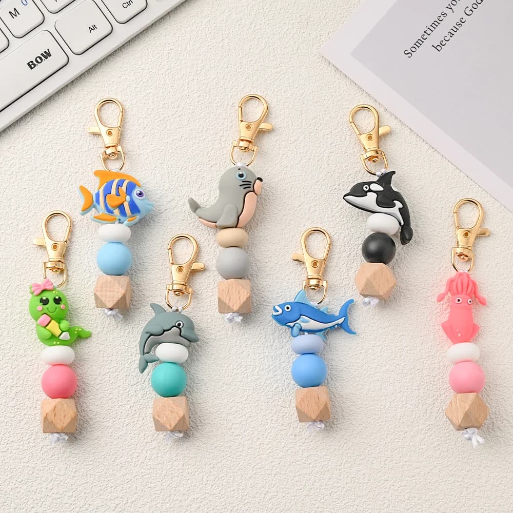 1 pz. Ciondolo in silicone con perline, simpatici animali marini dei cartoni animati, ganci per passeggino, accessorio decorativo, portachiavi in silicone a forma di pesce e delfino