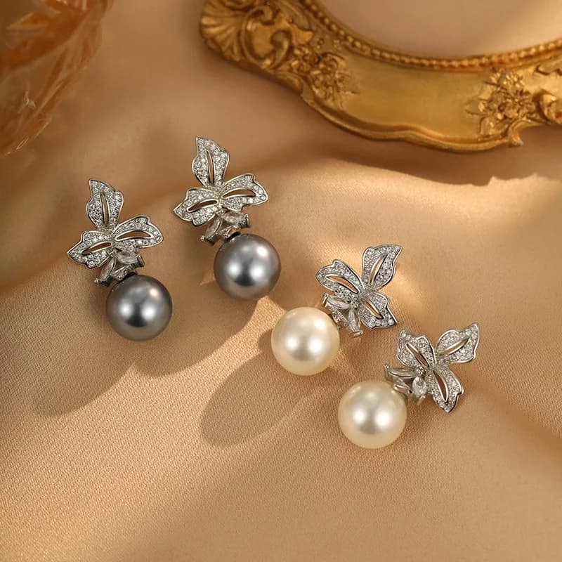 Pearl Earrings with iris flower, elegant and trendy, versatile and high-end, light luxury style, lbo earrings with niche design, exquisite.