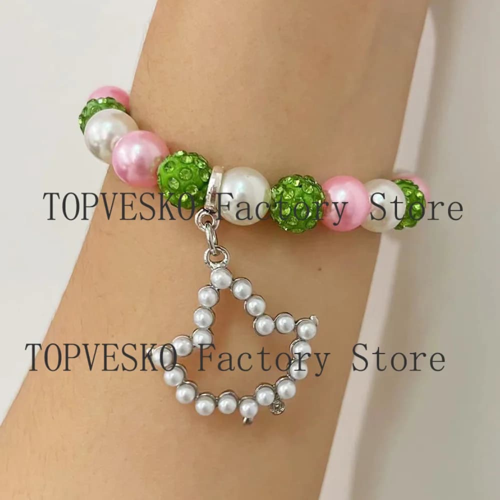Bracciale con pendente in edera di perle intarsiate con perline verdi rosa Alpha