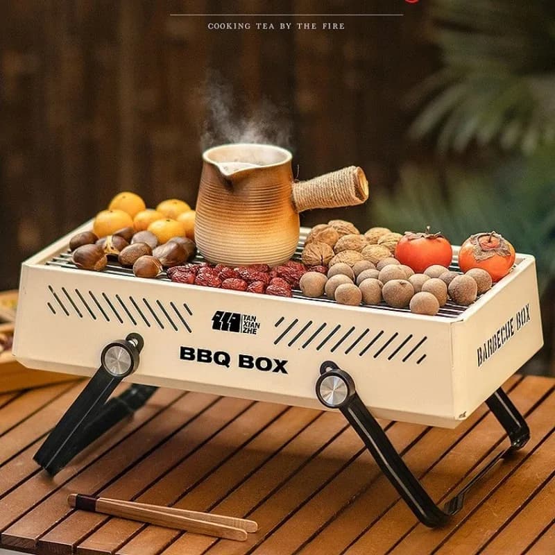 Set of small portable foldable barbecue grills, surrounded by outdoor grill stove with independent ventilated carbon tub