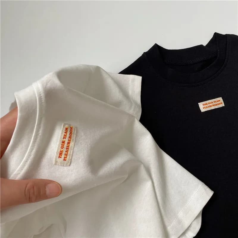 Abbigliamento per bambini stile coreano semplice tutto abbinato maglietta 2024 estate ragazzi ragazze moda Casual maglietta allentata in cotone a maniche corte