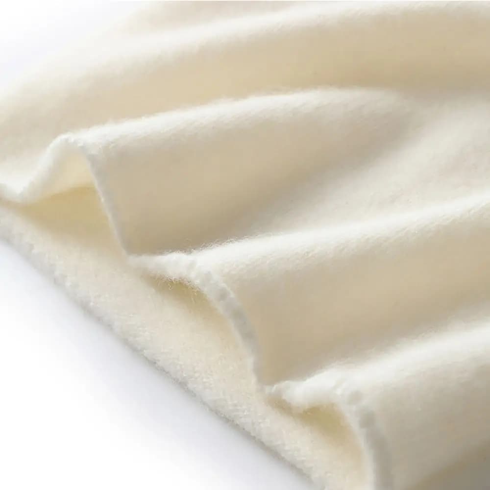 Cappello lavorato a maglia in cashmere e cashmere alla moda Cappello a cuffia unisex con bordo arrotolato Berretto di protezione per le orecchie in tinta unita