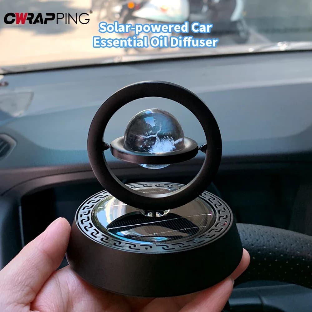 Deodorante per auto con rotazione automatica a 360° ° Gli ornamenti del cruscotto del diffusore di fragranza rimuovono gli accessori dell'aroma del profumo del detergente del camion dell'automobile