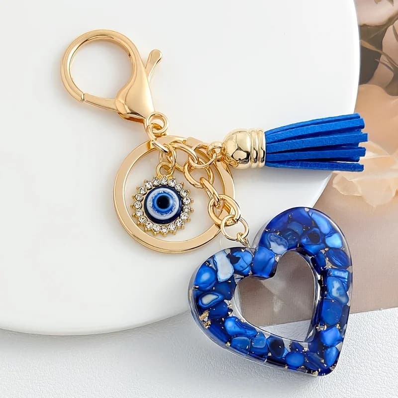 A Heart-Shaped Keychain Made of Epoxy Resin, Featuring a Devil'S Eye Tassel Charm, an Ideal Gift for Couples