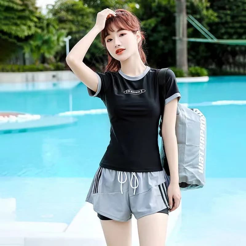 Women's sports swimsuit in two pieces with short sleeves and shorts with drawstring, suitable for beach and pool workouts