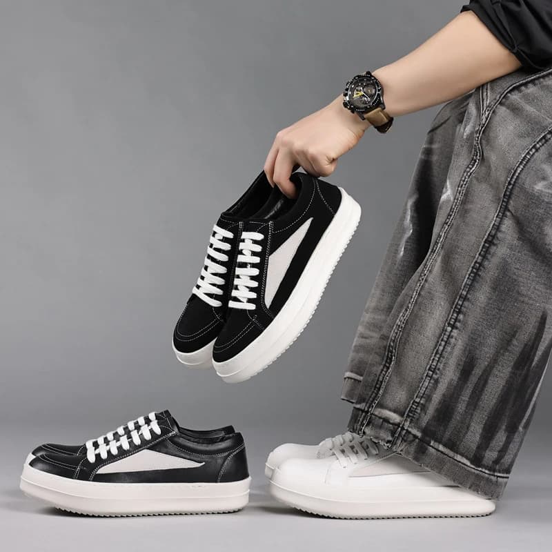 Sneakers da uomo nere in vera pelle con plateau e dettagli in camoscio bianco, modello basso con lacci, scarpe casual per uno stile streetwear.