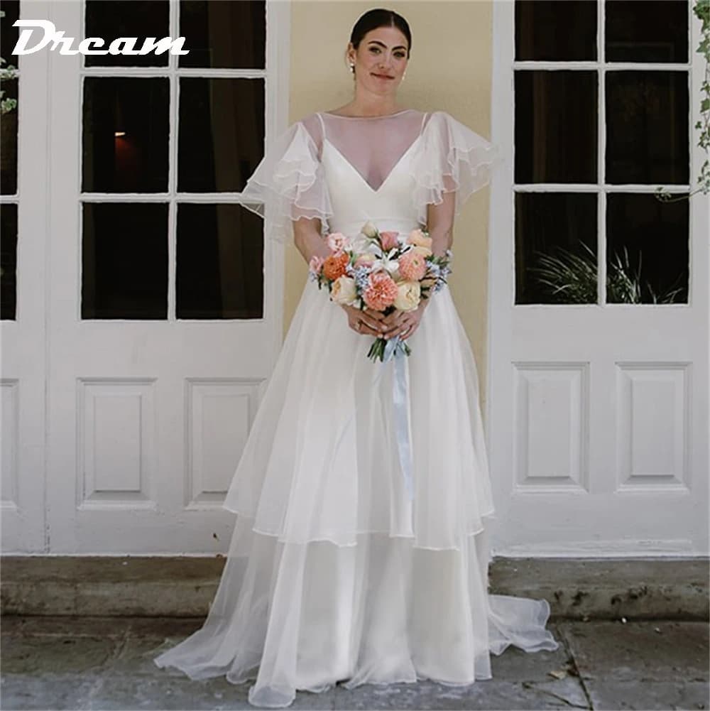 Abito da sposa DREAM personalizzato in organza con maniche corte a farfalla, gonna a strati, lunghezza del pavimento, senza schienale, abiti da sposa 2025
