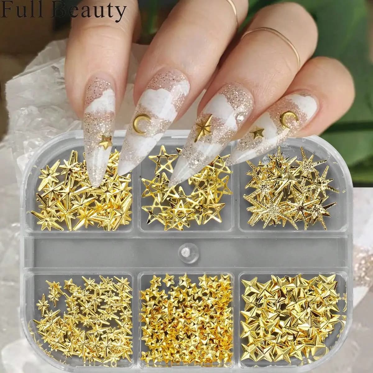 24 pezzi di unghie finte lunghe a stiletto con glitter e decorazioni in metallo a forma di stella e luna dorate