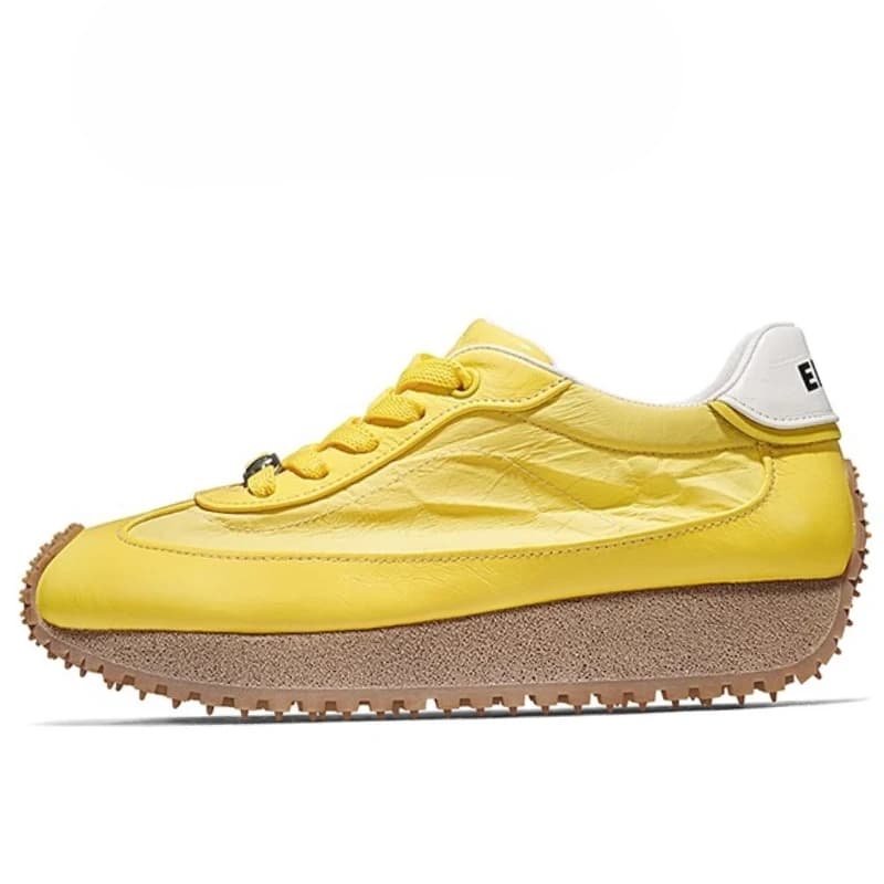 Yellow training shoes with increasing breathable height in genuine leather fabric for casual sports shoes with thick man and woman background