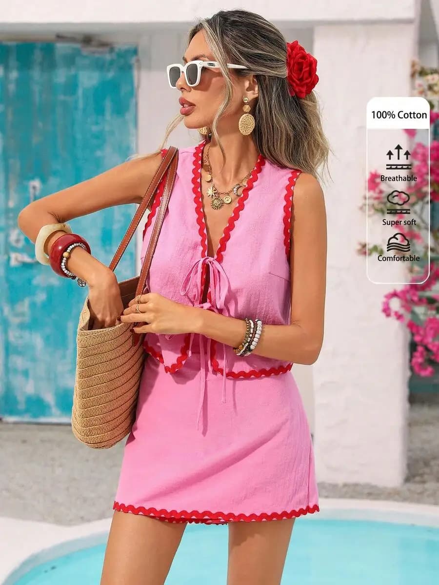 Completo due pezzi rosa da donna con laccetti sul davanti, outfit estivo casual per vacanze al mare, gonna e top