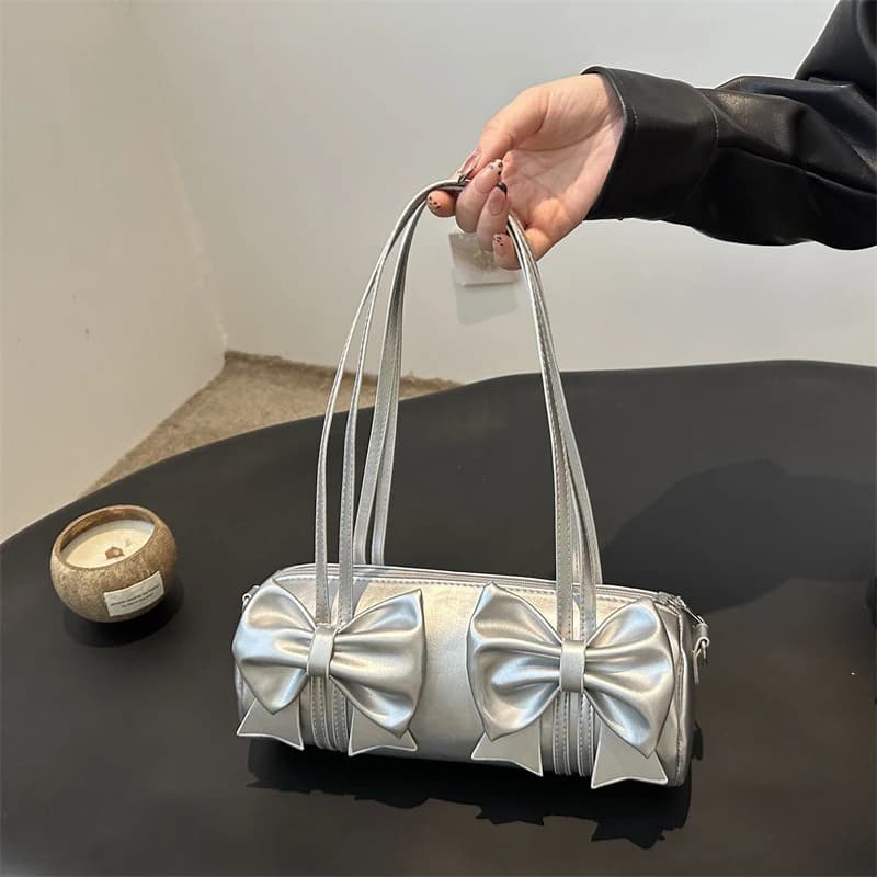Il nuovo modello 2025 presenta una borsa sotto le ascelle di fascia alta di nicchia, una borsa da cuscino da donna alla moda con design a fiocco alla moda e una borsa a tracolla