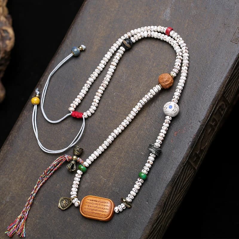 Bracciale multistrato con perle di bodhi a forma di luna, legno di pesco, agata rossa e perle dzi, piccolo thangka dipinto a mano