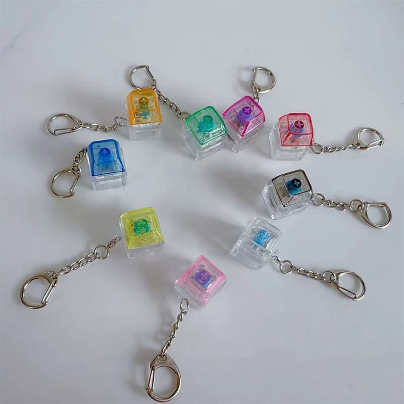 Keychain with anti-stress keyboard; 1 button transparent LED mechanical Toy for DIY fans