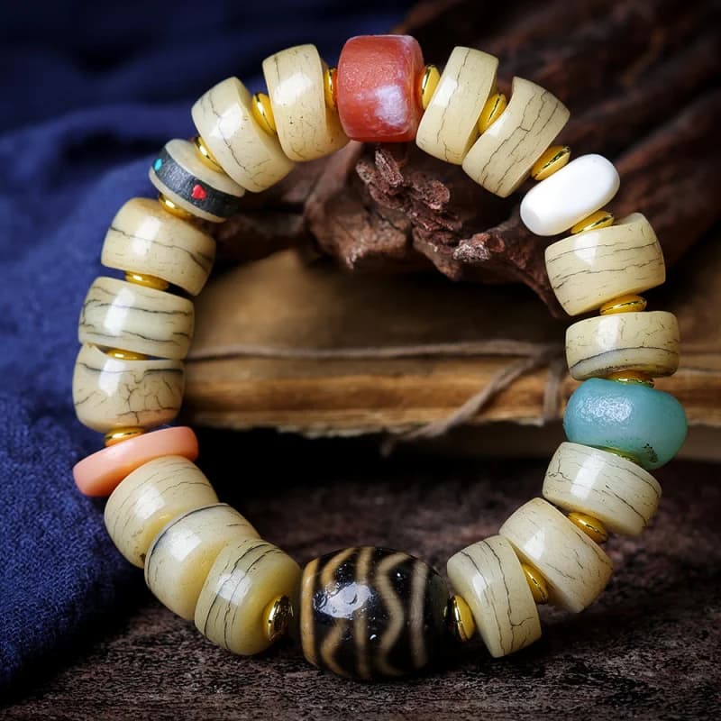 Gioielli tibetani Modello scoppio di osso di yak Perlina intestino crasso Bracciale culturale con doppio dente di tigre Dzi in agata antica