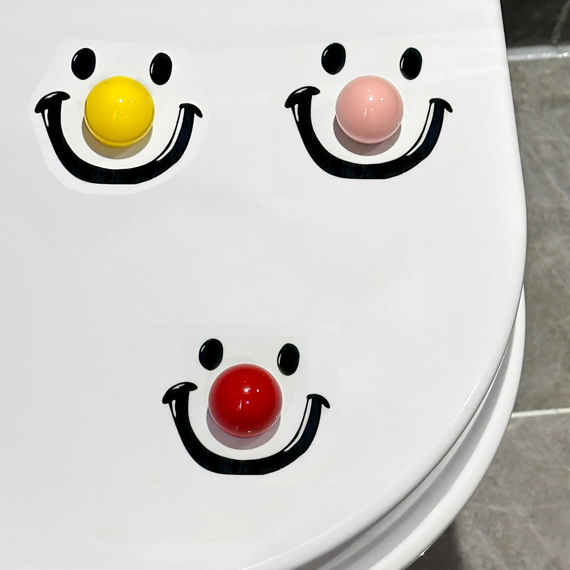 Simpatico sollevatore per sedile WC con clown sorridente, manico sanitario touch-free per zampa di gatto per un facile sollevamento igienico, divertente gadget da bagno per la casa