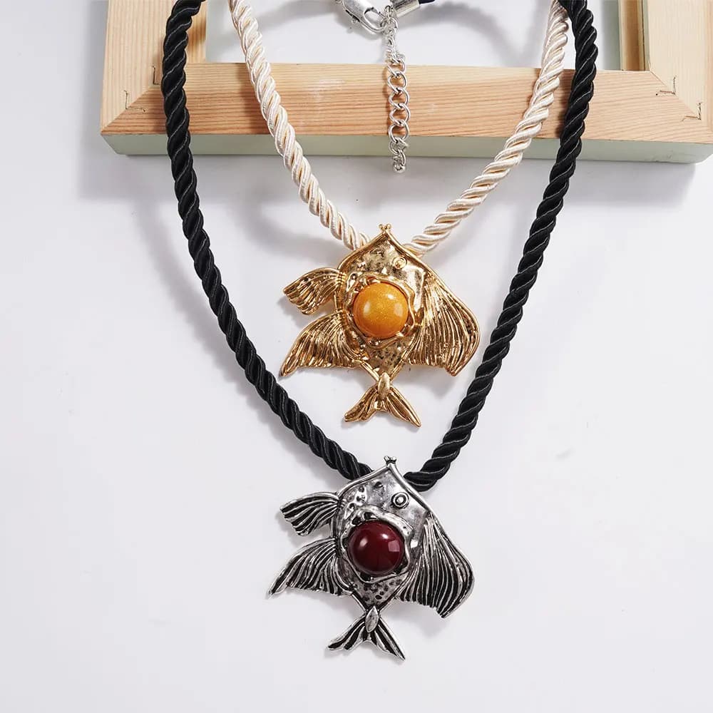 Necklaces with vintage fish shaped pendant Braided rope chain Adjustable length Jewels Boho Declaration with two-tone colored beads center