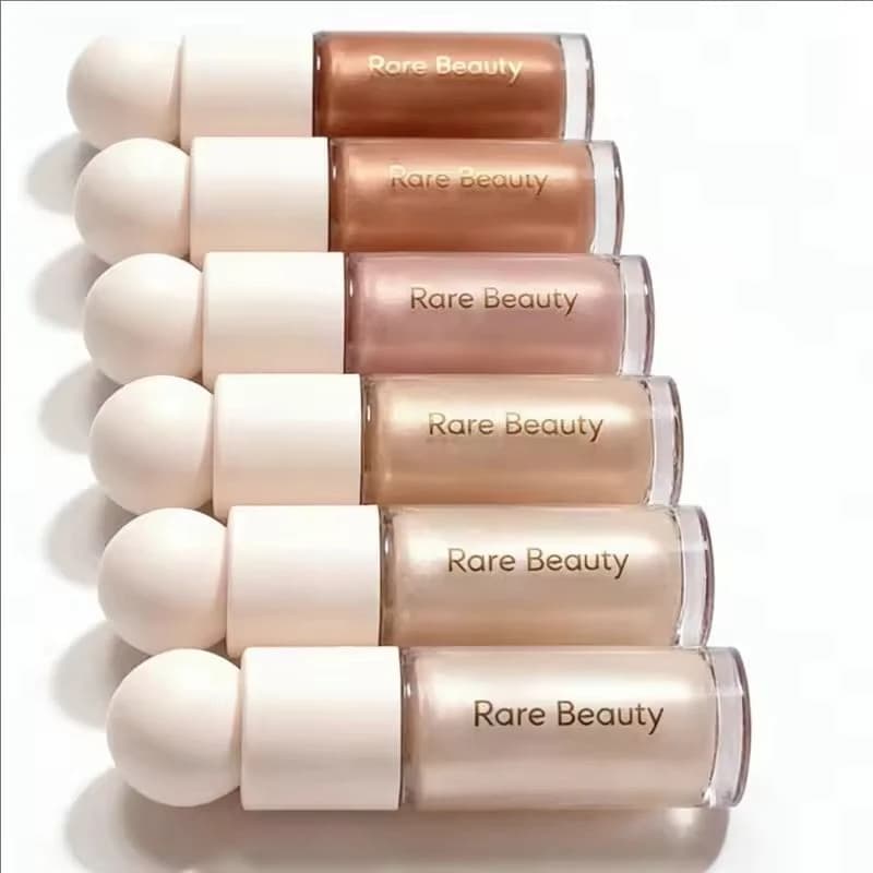 Cosmetici liquidi illuminanti per il trucco Fashion Rare Beauty, facili da applicare, utili per migliorare il contorno del viso e l'illuminazione naturale.