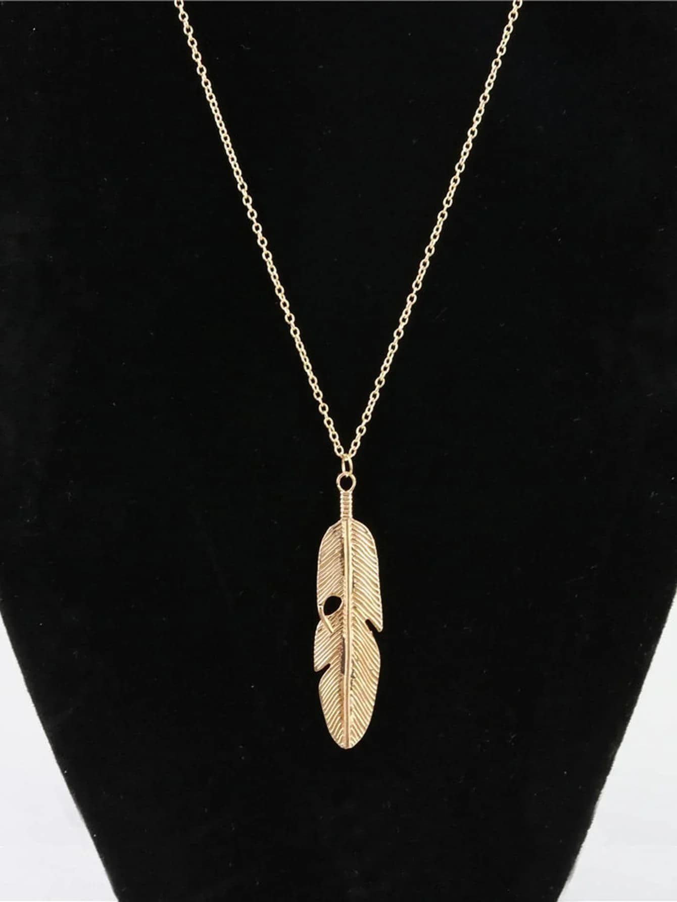 Feather charm pendant necklace with delicate long chain design