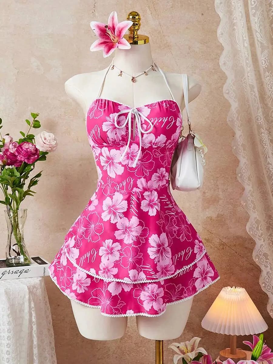 Abito da donna con stampa floreale, scollo all'americana, fiocco frontale e minigonna con orlo a balze, ideale per le vacanze al mare