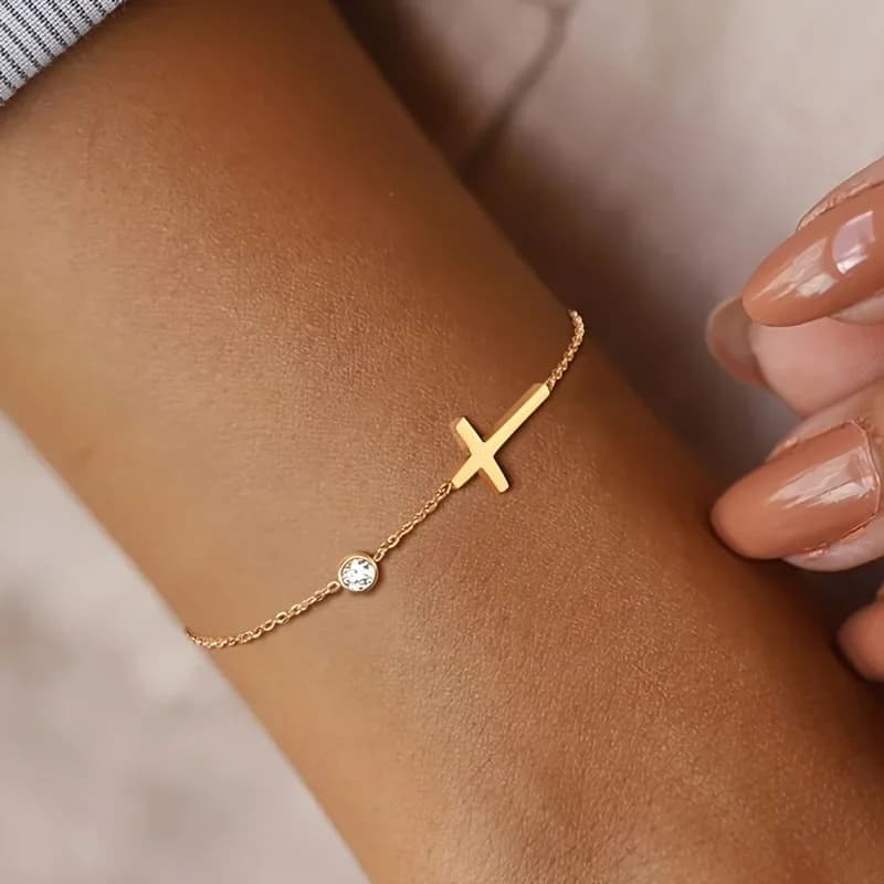 1 elegante e minimalista braccialetto con ciondolo a croce e perline rotonde in acciaio inossidabile, adatto per giovani donne da indossare alle feste.