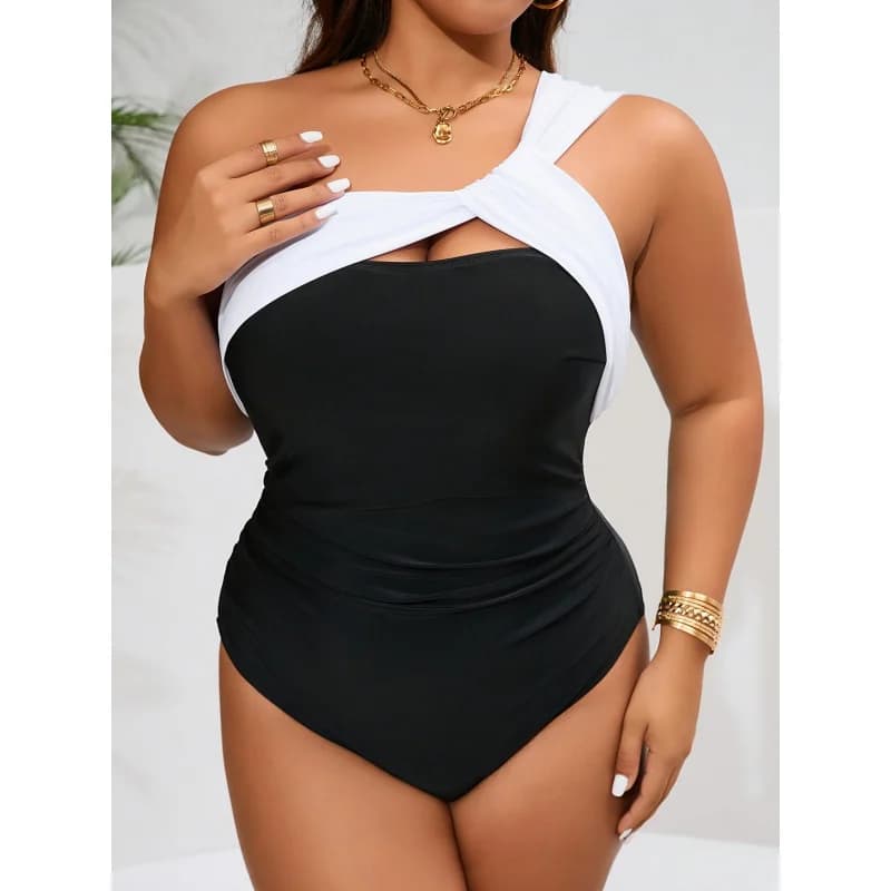 Women's entire swimsuit mono-sponge color block with asymmetric design, curled, strong sizes, fashionable, resort style, for the beach