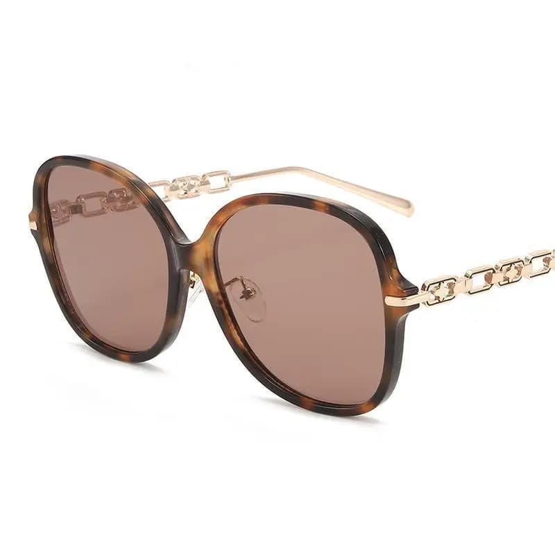Occhiali da sole ovali con montatura grande, stile europeo e americano, decorazione a catena personalizzata, occhiali da sole versatili per street style e influencer.