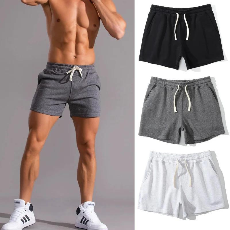 2025 Pantaloncini fitness estivi da palestra Pantaloncini sportivi casual elastici da uomo 2 pezzi Traspirante Surfing Seaside Resort Abbigliamento sportivo da corsa solido