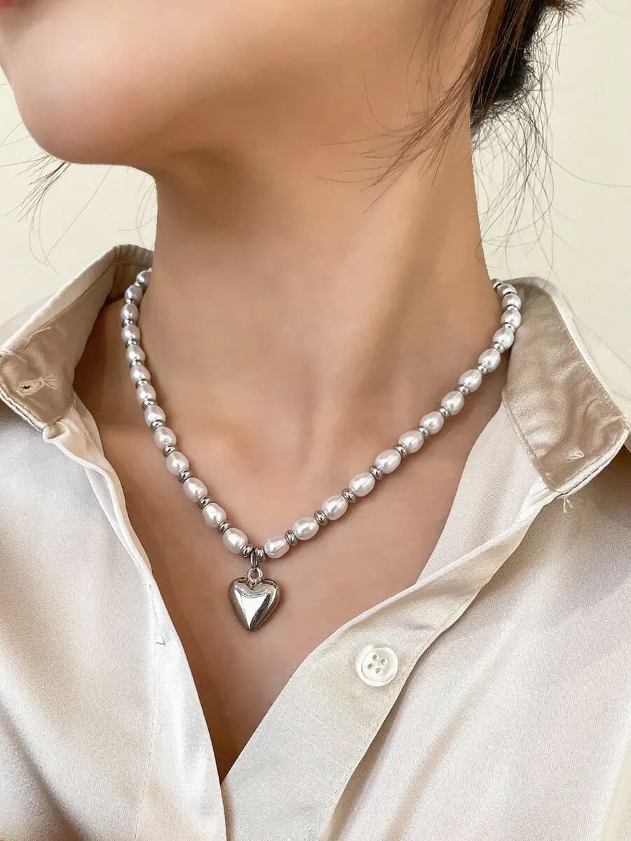 Heart-shaped pendant necklace with faux pearl embellishment