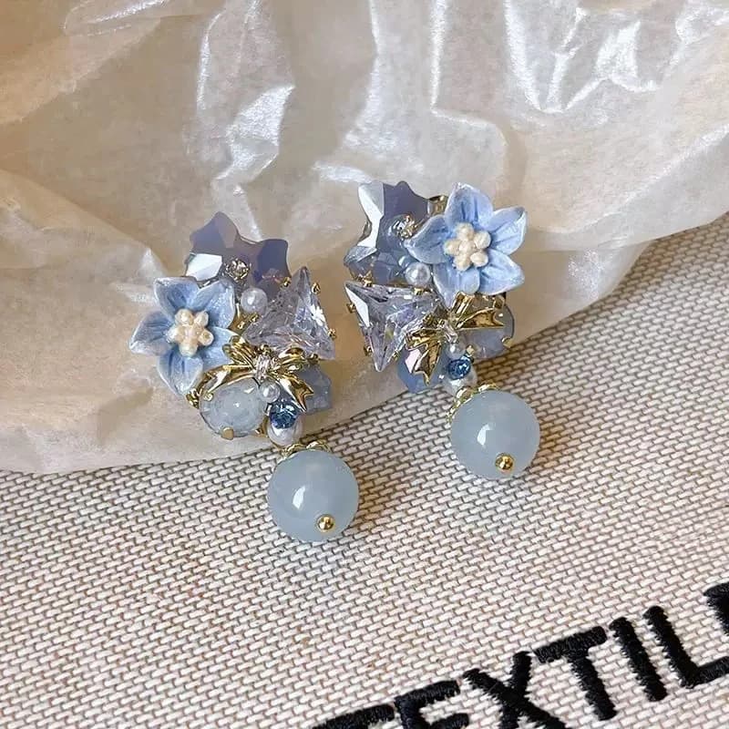 A pair of shiny new Chinese earrings - blue and pink contrasting floral bows and beaded stud earrings, exquisitely designed for everyday wear, weddings, parties, and as a year-round gift