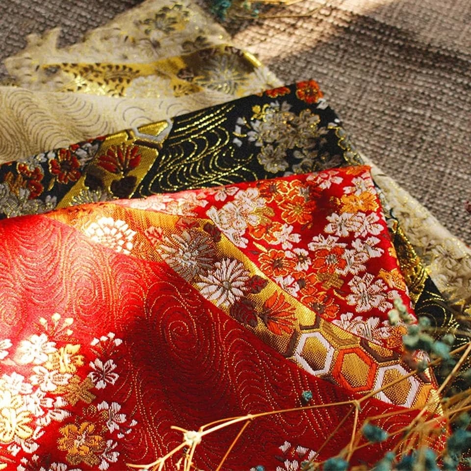 150cm wide woven brocade with cherry blossom gold thread woven on handmade branches