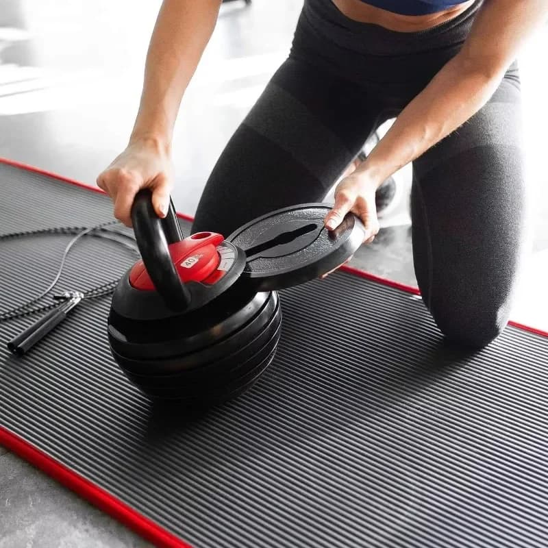 Kettlebell regolabile personalizzato in ghisa resistente per esercizi domestici e allenamento quotidiano di forza