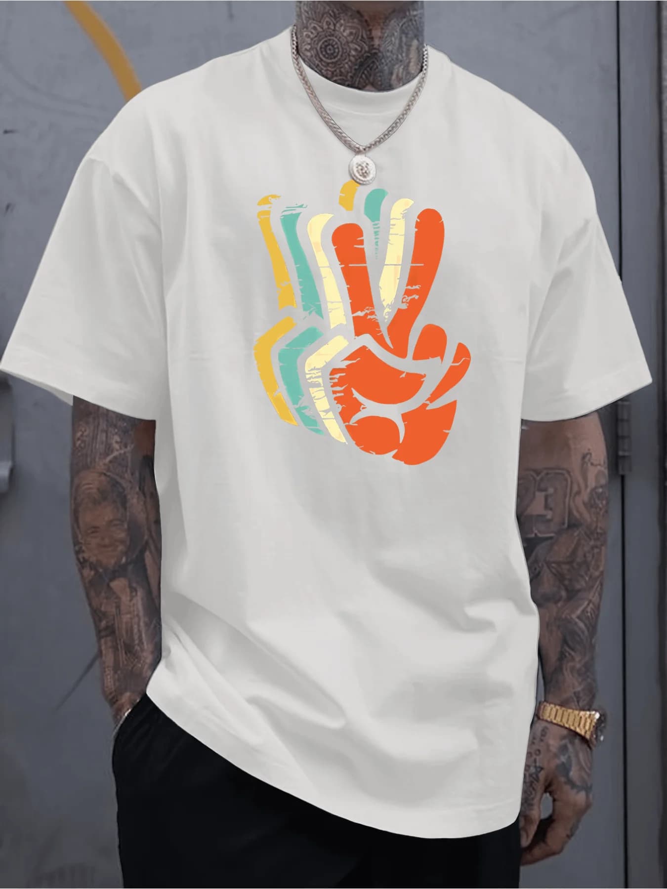 Short-sleeved men's t-shirt with retro print: black shirt, colorful logo with symbol of peace and design with abstract gesture
